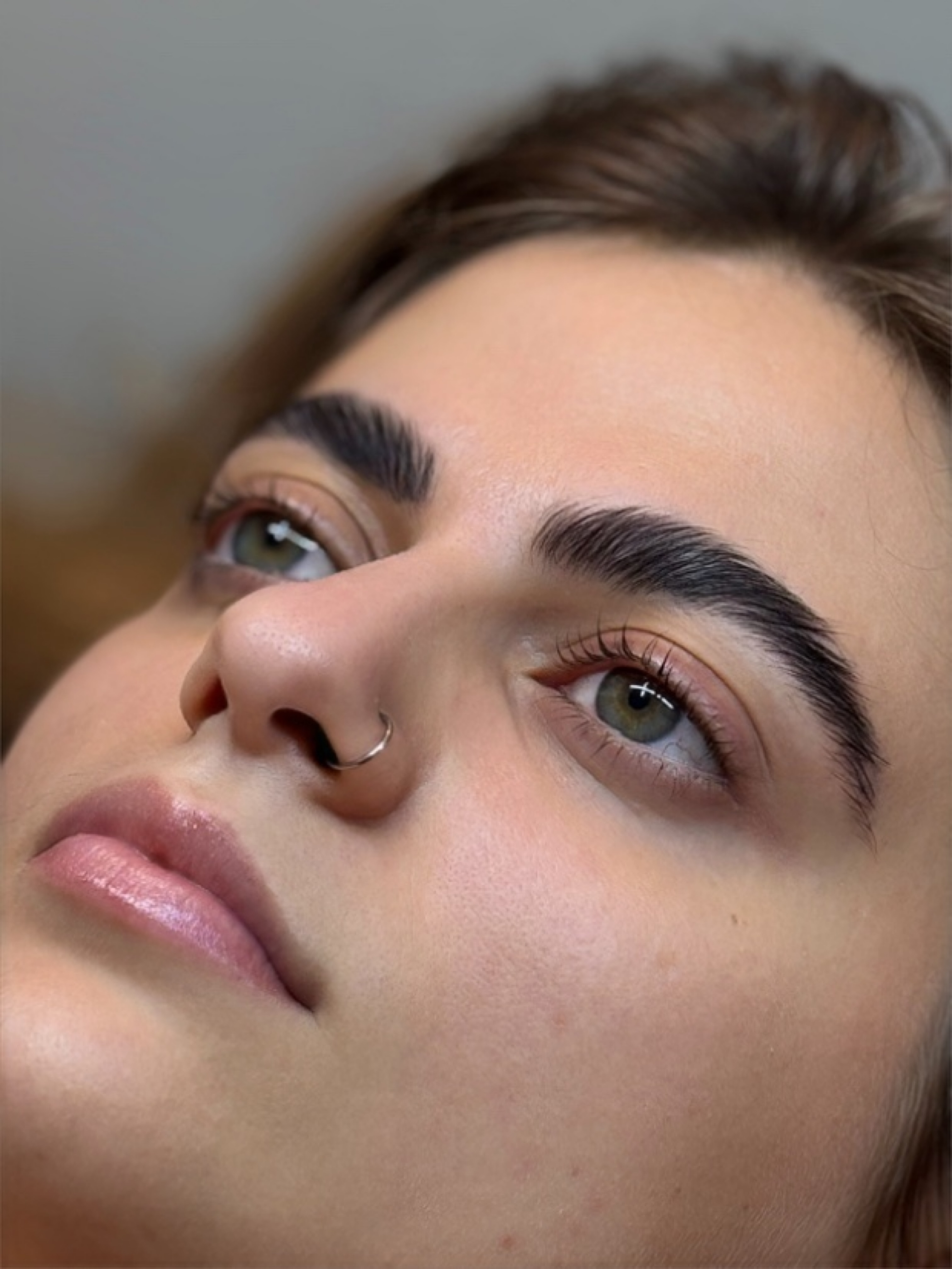 Finished lash lift and brow lamination result showing sleek, lifted lashes and brows.